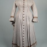 Housedress, cotton printed with a brown geometric pattern, separate underskirt, c. 1875, front view