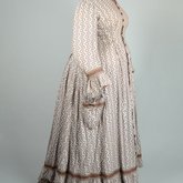 Housedress, cotton printed with a brown geometric pattern, separate underskirt, c. 1875, side view