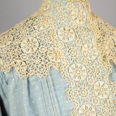 Dress, blue cotton with pouched bodice, tailored skirt, lace yoke, and matching belt, c. 1905, detail of bodice lace