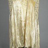 Evening dress, cream panne velvet with rhinestones and embroidery, 1929, front detail of floating skirt panels