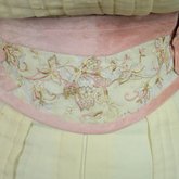 Dress, cream wool trimmed with lace, pink velvet, and multi-colored machine embroidery, 1908, detail of sash