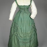 Dress, green damask silk with integral Swiss waist over a cotton blouse, 1860-1863, front view