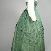 Dress, green damask silk with integral Swiss waist over a cotton blouse, 1860-1863, side view