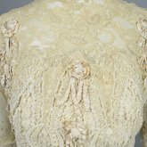 Dress, House of Rouff, cream wool with lace-draped bodice and sleeves, trimmed with cording, ribbon fronds, and roses, c. 1905, detail of bodice overlay