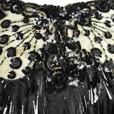 Evening gown, House of Rouff, black silk taffeta and satin with layered black net overlays embroidered with elongated black spangles and round sequins, c. 1905, detail of bodice