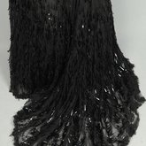 Evening gown, House of Rouff, black silk taffeta and satin with layered black net overlays embroidered with elongated black spangles and round sequins, c. 1905, detail of skirt