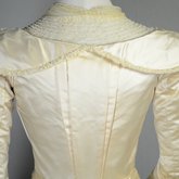 Wedding dress, cream silk satin and lace with long sleeves and a train, c. 1905, detail of bodice back