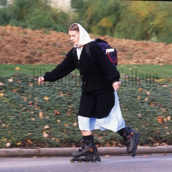 Amish woman rollerblading