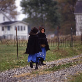 Amish girls walking along road