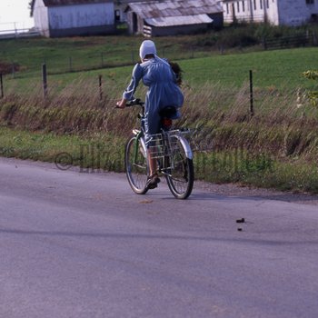 Amish woman bicycling 2