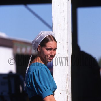 Young Amish woman at produce auction