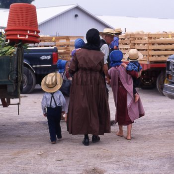 Elderly Amish couple with children