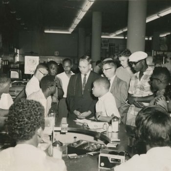 Reporters talk with Alton Yates and Rodney Hurst during the first sit-in demonstration, August 13, 1960.  Digitally Retouched Version.
