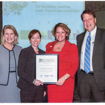 Susan Towler receiving The Secretaries' Award for Public-Philanthropic Partnerships on behalf of the Blue Foundation