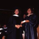 1992 Lynn Commencement: Christine Lynn presents Trustees Medal to Cynthia Cergueira