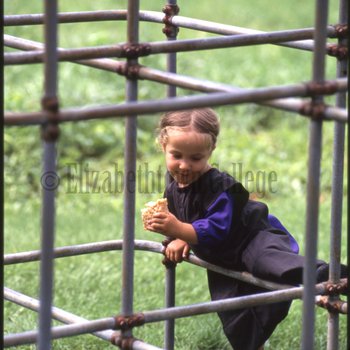 Amish girl on playground 2
