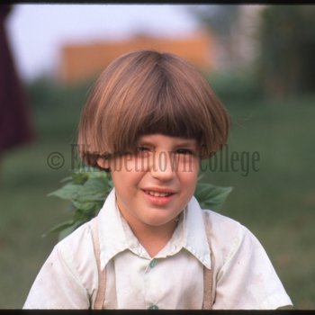 Amish boy with flowers