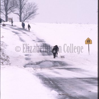 Amish children walk in snow