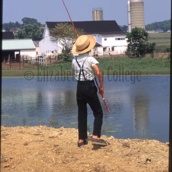 Boy holding fishing rod 2