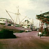 Unloading cargo with ship's boom A