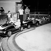 Cars on a track at the Super Test Amusement Park