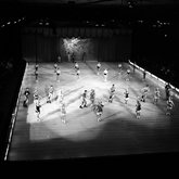 Ice skating troupe performing a routine