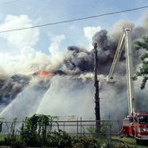 Old Emilio Pons cigar factory in flames and fire truck