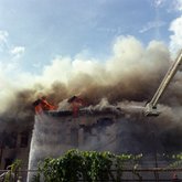 Old Emilio Pons cigar factory in flames and bucket of fire truck