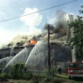 Firefighters attempting to quench flames at Old Emilio Pons cigar factory