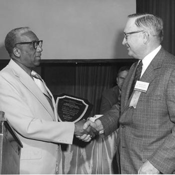 Virgil Sapp Receiving National University Extension Association Award from John Ervin 2384