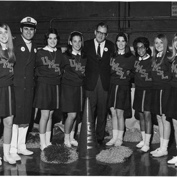 Cheerleaders and Riverman Mascot with UM President, John Weaver, C. 1968-1969 3077