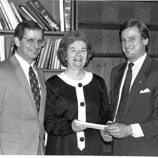 Chancellor Touhill Receiving Donation for New Apple Computers from Jerry Malec and W. Randall Jennings, C. 1990s 3469