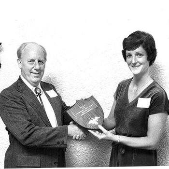 Kenneth Kincheloe Receiving Distinguished Service Award from Barbara Maier, C. 1970s 3509