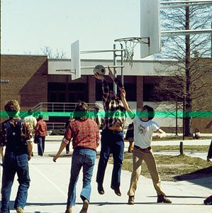Students Playing Basketball Near J.C. Penney Building 3848