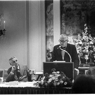 UM President Brice Ratchford at Podium/Chancellor Grobman and Others, C. Late 1970s 4245