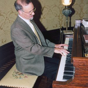 Chancellor Tom George Playing Piano 4498
