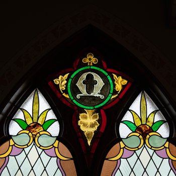 Symbol of Omega Southeast Nave Window 1.5
