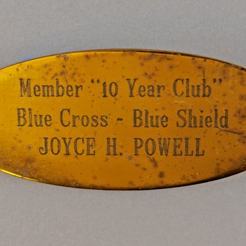 Member 10 Year Club Blue Cross-Blue Shield Joyce H. Powell brass nameplate, undated