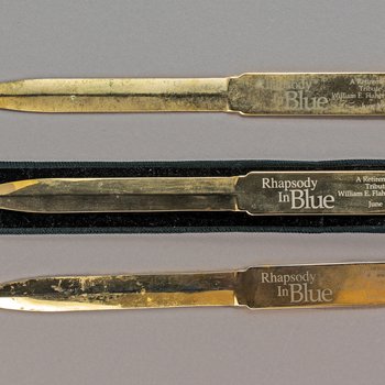 “Rhapsody in Blue” A Retirement Tribute to William E. Flaherty, 1998 Letter Opener, circa 1988 (3, 1 is in a sleeve)