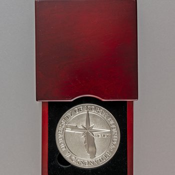 Wood box with University of North Florida medallion, undated