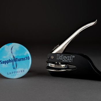 #SapphireTurns10 Sapphire Awards button, undated; The Blue Foundation for a Healthy Florida, Inc., 2001 Seal Embosser, circa 2001