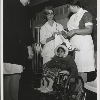 Nurses Preparing Young Patient for Moving Day