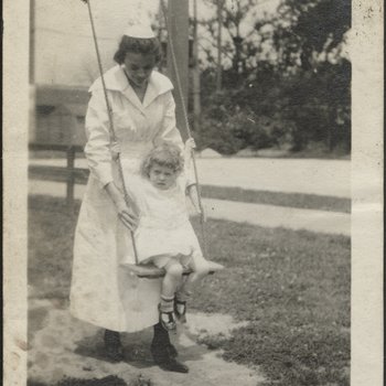 Nurse with Young Girl on Swing