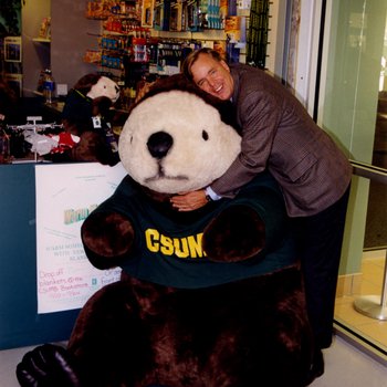 Peter Smith Hugging CSUMB Mascot Monte Rey