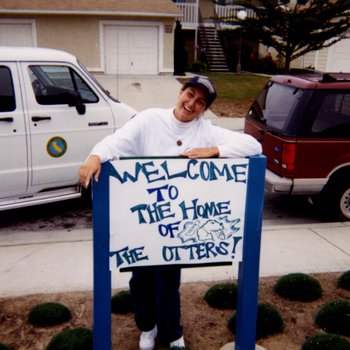 Staff Member With Otter Sign in CSUMB East Campus Housing