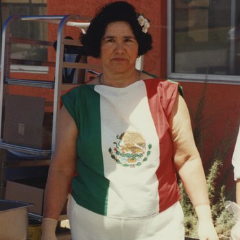 Woman Serving Food at Cinco de Mayo Celebration