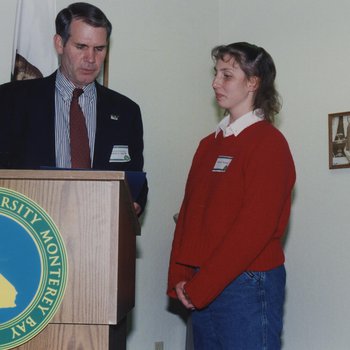 Robert L. Ord III at Podium With Student