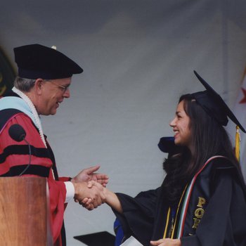 Peter Smith Shaking Hands With Graduate