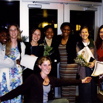 Students Holding Certificates and Flowers