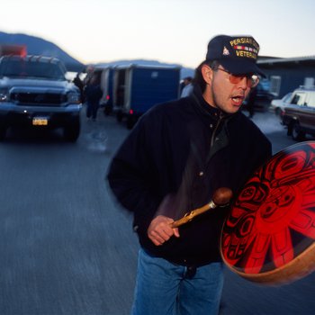 Don Johnson of the Tlingit Nation escorts a Bear Clan Totem off a ferry at Angoon, Alaska, November 1, 2003.